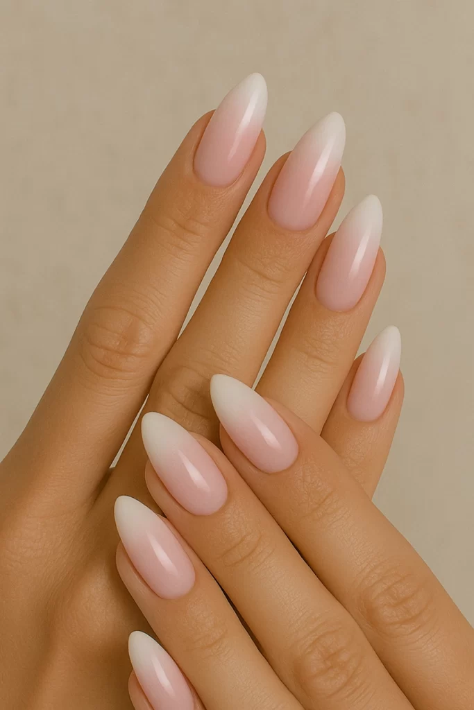Elegant baby boomer nails with almond shape.