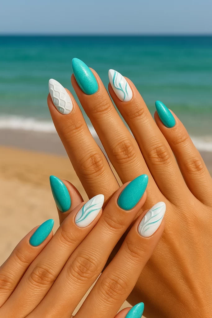 Mermaid-inspired turquoise and white nails with sparkle