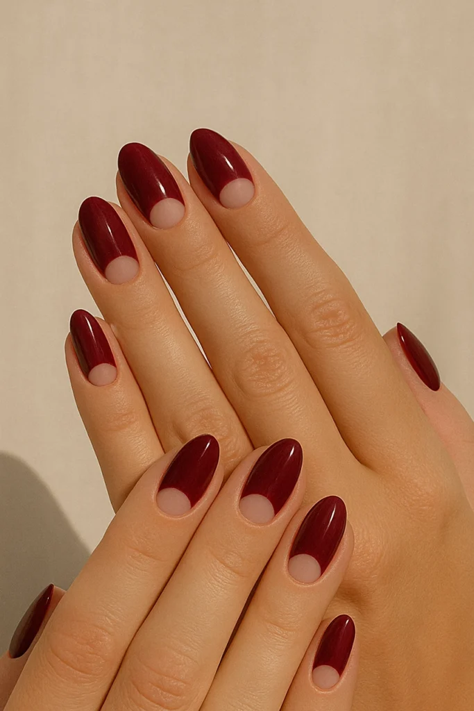 felhold-manikur-4 Burgundy half-moon nails on oval-shaped nails