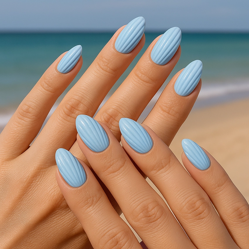Seashell nail design in pastel blue