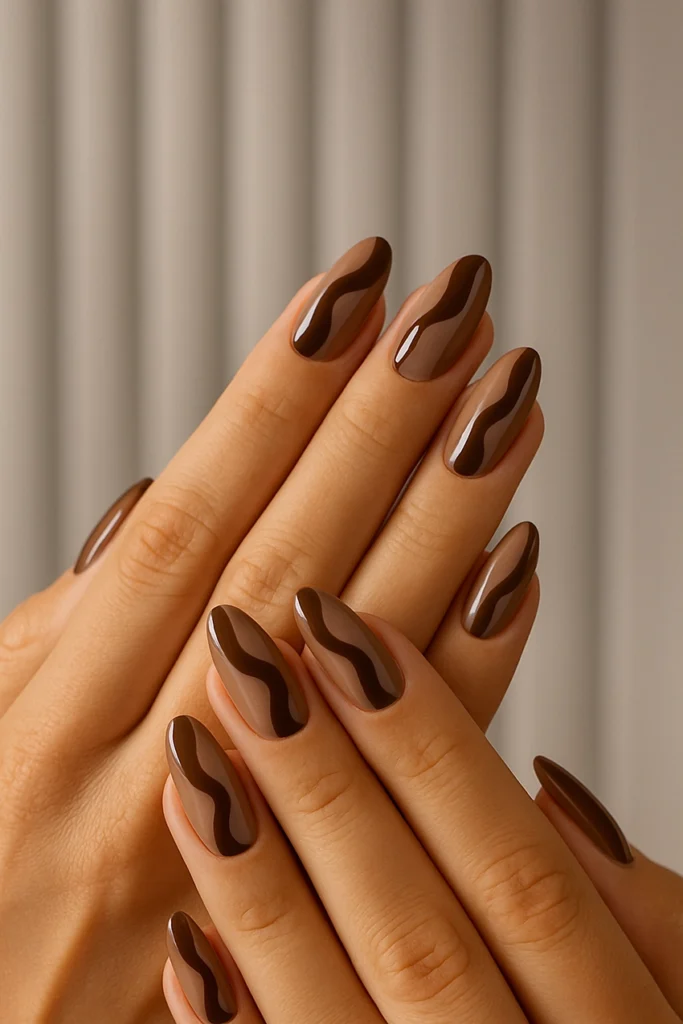 Brown nails with golden accents