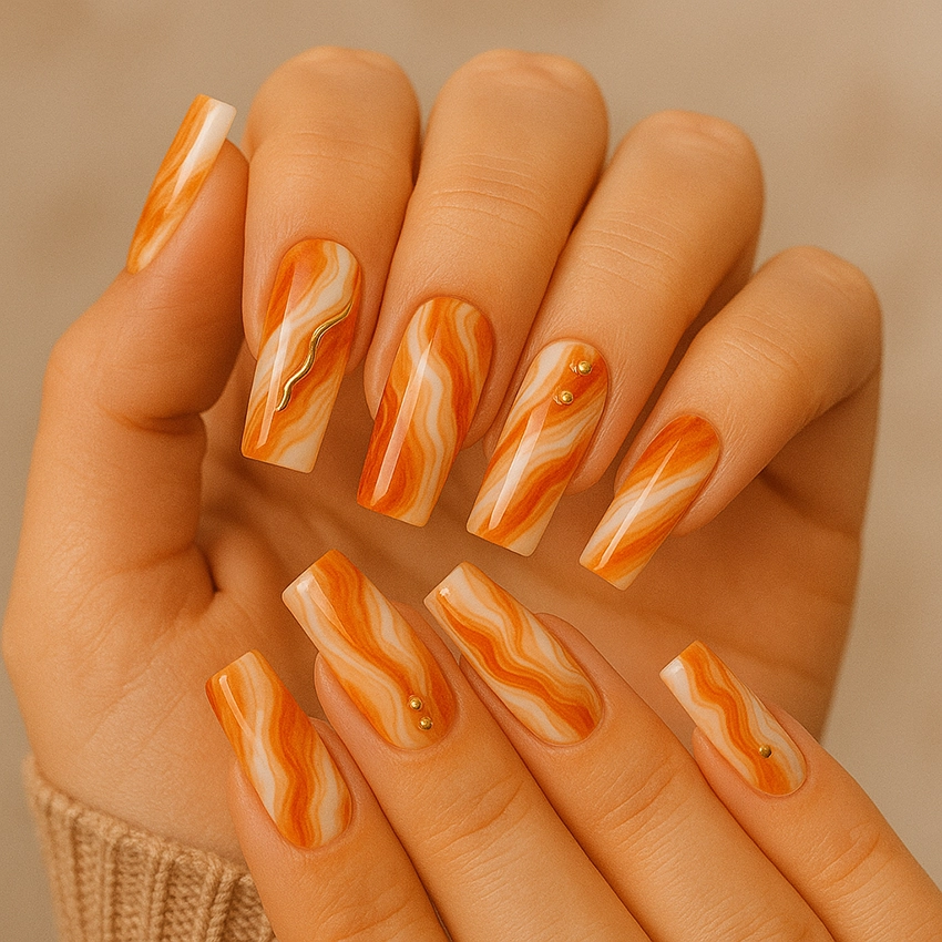 Autumn nail art with wavy orange pattern