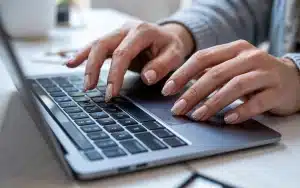 nail ideas modern matte peach-colored nails in an office environment for the holiday.